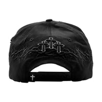 Parte trasera de la gorra Rude Awakenings con cruz bordada